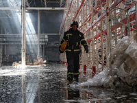 A firefighter is being seen inside a warehouse damaged by a Russian missile strike in Odesa, Ukraine, on June 24, 2024. NO USE RUSSIA. NO US...