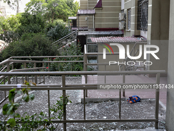 Glass shards are carpeting the ground around an apartment block damaged by a Russian missile attack on civilian infrastructure in Odesa, Ukr...