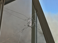 A hole in a windowpane is being pictured in an apartment building after a Russian missile attack on civilian infrastructure in Odesa, Ukrain...