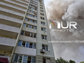 Smoke is rising from a civilian infrastructure facility damaged by a Russian missile attack near an apartment building in Odesa, Ukraine, on...