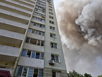 Smoke is rising from a civilian infrastructure facility damaged by a Russian missile attack near an apartment building in Odesa, Ukraine, on...