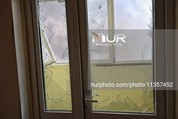 Smashed windows are being pictured in an apartment building after a Russian missile attack on civilian infrastructure in Odesa, Ukraine, on...