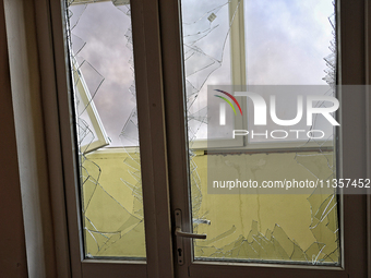 Smashed windows are being pictured in an apartment building after a Russian missile attack on civilian infrastructure in Odesa, Ukraine, on...