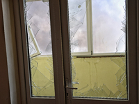 Smashed windows are being pictured in an apartment building after a Russian missile attack on civilian infrastructure in Odesa, Ukraine, on...