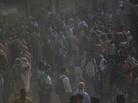 People are watching from a distance as firefighters and civilians are working to extinguish a fire in Srinagar, Jammu and Kashmir, on June 2...