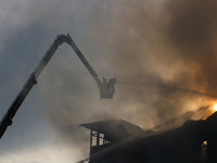 Indian firefighters are working to extinguish a fire in Srinagar, Jammu and Kashmir, on June 24, 2024. A mosque and some buildings are being...