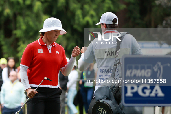 Amy Yang of Republic of Korea celebrates her birdie on the 8th green with her caddie during Day Four of the KPMG Women's PGA Championship at...