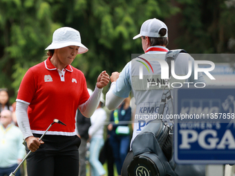 Amy Yang of Republic of Korea celebrates her birdie on the 8th green with her caddie during Day Four of the KPMG Women's PGA Championship at...