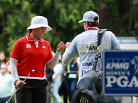 Amy Yang of Republic of Korea celebrates her birdie on the 8th green with her caddie during Day Four of the KPMG Women's PGA Championship at...