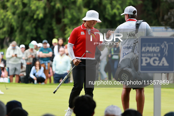 Amy Yang of Republic of Korea celebrates her birdie on the 8th green with her caddie during Day Four of the KPMG Women's PGA Championship at...