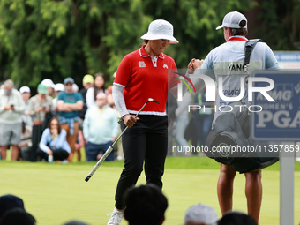 Amy Yang of Republic of Korea celebrates her birdie on the 8th green with her caddie during Day Four of the KPMG Women's PGA Championship at...