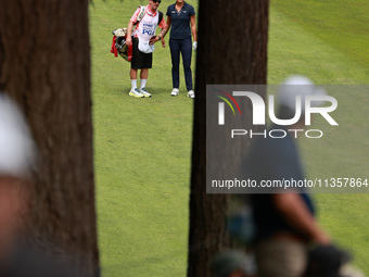 Lexi Thompson of the United States interacts with her caddy on the 16th hole during Day Four of the KPMG Women's PGA Championship at Sahalee...