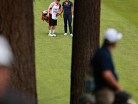 Lexi Thompson of the United States interacts with her caddy on the 16th hole during Day Four of the KPMG Women's PGA Championship at Sahalee...