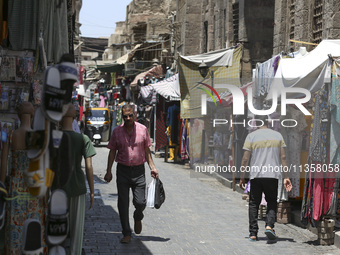 Al-Moez Street in Al-Gamaleya neighborhood next to the Khan Al-Khalili market area, on June 24, 2024, in Cairo, Egypt, is containing the lar...