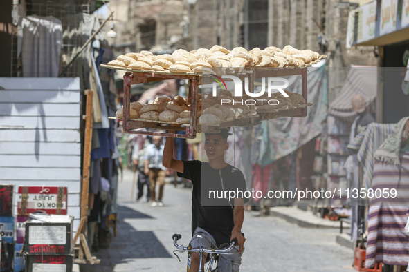 Al-Moez Street in Al-Gamaleya neighborhood next to the Khan Al-Khalili market area, on June 24, 2024, in Cairo, Egypt, is containing the lar...