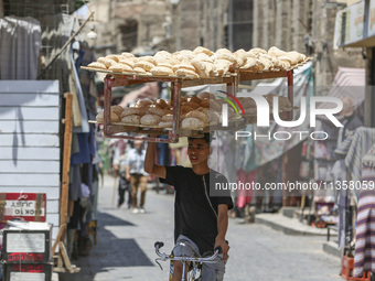 Al-Moez Street in Al-Gamaleya neighborhood next to the Khan Al-Khalili market area, on June 24, 2024, in Cairo, Egypt, is containing the lar...