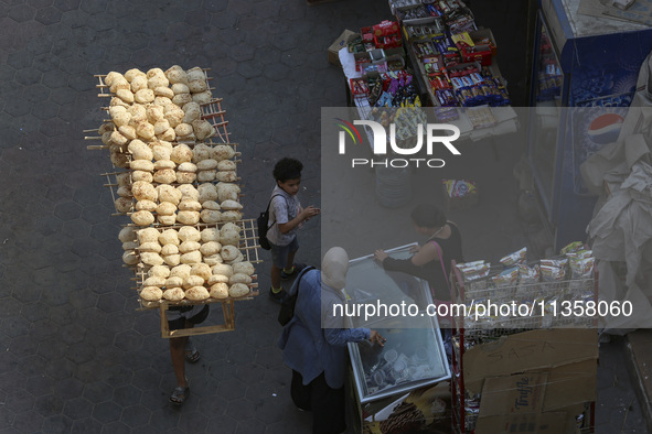 Al-Moez Street in Al-Gamaleya neighborhood next to the Khan Al-Khalili market area, on June 24, 2024, in Cairo, Egypt, is containing the lar...