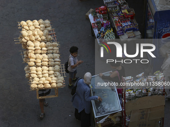 Al-Moez Street in Al-Gamaleya neighborhood next to the Khan Al-Khalili market area, on June 24, 2024, in Cairo, Egypt, is containing the lar...