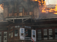 A fire is engulfing a residential house in a congested neighborhood in Old City Srinagar, Indian Administered Kashmir, on June 24, 2024. Sev...