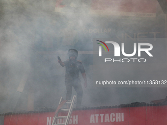 Firefighters are trying to contain the fire in a congested neighborhood in Old City Srinagar, Indian Administered Kashmir, on June 24, 2024....