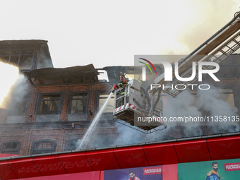 Firefighters are trying to douse the fire in a congested neighborhood in Old City Srinagar, Indian Administered Kashmir, on June 24, 2024. S...