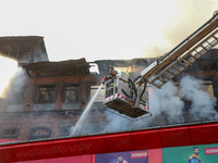 Firefighters are trying to douse the fire in a congested neighborhood in Old City Srinagar, Indian Administered Kashmir, on June 24, 2024. S...