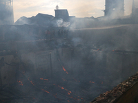 Firefighters are trying to douse the fire in a congested neighborhood in Old City Srinagar, Indian Administered Kashmir, on June 24, 2024. S...