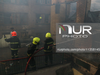 Firefighters are trying to douse the fire in a congested neighborhood in Old City Srinagar, Indian Administered Kashmir, on June 24, 2024. S...