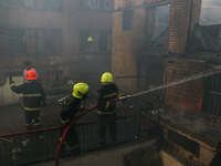 Firefighters are trying to douse the fire in a congested neighborhood in Old City Srinagar, Indian Administered Kashmir, on June 24, 2024. S...