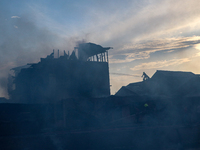 Firefighters are trying to douse the fire in a congested neighborhood in Old City Srinagar, Indian Administered Kashmir, on June 24, 2024. S...