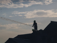 Firefighters are trying to douse the fire in a congested neighborhood in Old City Srinagar, Indian Administered Kashmir, on June 24, 2024. S...