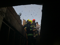 Firefighters are trying to douse the fire in a congested neighborhood in Old City Srinagar, Indian Administered Kashmir, on June 24, 2024. S...