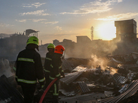 Firefighters are trying to douse the fire in a congested neighborhood in Old City Srinagar, Indian Administered Kashmir, on June 24, 2024. S...