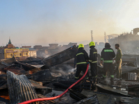 Firefighters are trying to douse the fire in a congested neighborhood in Old City Srinagar, Indian Administered Kashmir, on June 24, 2024. S...