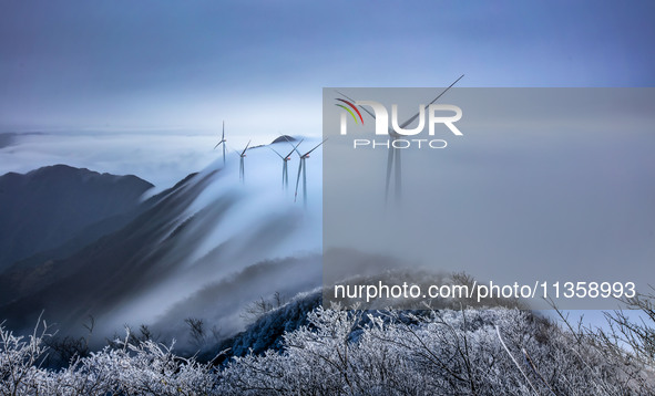 Wind power facilities are being seen at the core observation area of Geyuan, the Chinese Dark Night Starry Sky Protected Area, in Shangrao,...