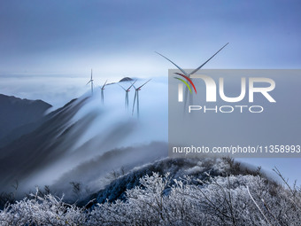 Wind power facilities are being seen at the core observation area of Geyuan, the Chinese Dark Night Starry Sky Protected Area, in Shangrao,...