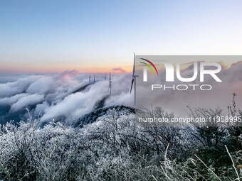 Wind power facilities are being seen at the core observation area of Geyuan, the China Dark Night Sky Protected Area, in Shangrao, China, on...