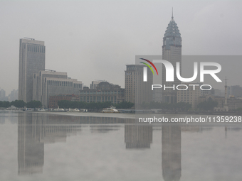 Reflection is being seen from Bingjiang Dadao along the Huangpu River in Shanghai, China, on June 25, 2024, as China is issuing a rainstorm...