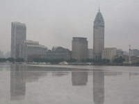 Reflection is being seen from Bingjiang Dadao along the Huangpu River in Shanghai, China, on June 25, 2024, as China is issuing a rainstorm...