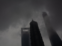 Skyscrapers are being seen under the heavy dark clouds at Lujiazui in Pudong in Shanghai, China, on June 25, 2024, as China is issuing a rai...