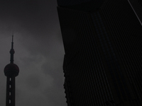 The Oriental Pearl TV Tower is being seen under heavy dark clouds at Lujiazui in Pudong in Shanghai, China, on June 25, 2024, as China is is...