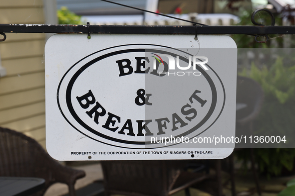 A sign is standing outside a bed and breakfast in Niagara-on-the-Lake, Ontario, Canada, on June 12, 2024. 