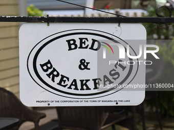 A sign is standing outside a bed and breakfast in Niagara-on-the-Lake, Ontario, Canada, on June 12, 2024. (