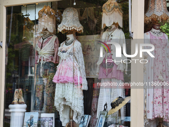 Antiquated clothing is being displayed in the window of a shop in Niagara-on-the-Lake, Ontario, Canada, on June 12, 2024. (