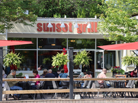 People are eating on a restaurant patio in Niagara-on-the-Lake, Ontario, Canada, on June 12, 2024. (