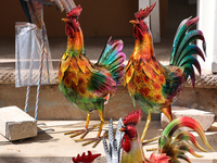 Metal roosters are being displayed outside a shop in Niagara-on-the-Lake, Ontario, Canada, on June 12, 2024. (