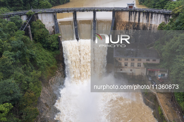 An aerial photo is showing the flood discharge at the Yongli Hydropower Station in Congjiang County, Southwest China's Guizhou Province, on...