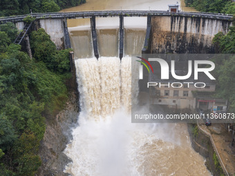 An aerial photo is showing the flood discharge at the Yongli Hydropower Station in Congjiang County, Southwest China's Guizhou Province, on...