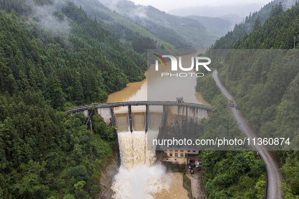 An aerial photo is showing the flood discharge at the Yongli Hydropower Station in Congjiang County, Southwest China's Guizhou Province, on...