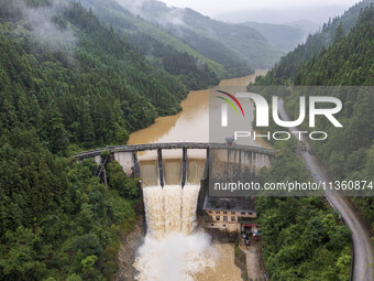 An aerial photo is showing the flood discharge at the Yongli Hydropower Station in Congjiang County, Southwest China's Guizhou Province, on...